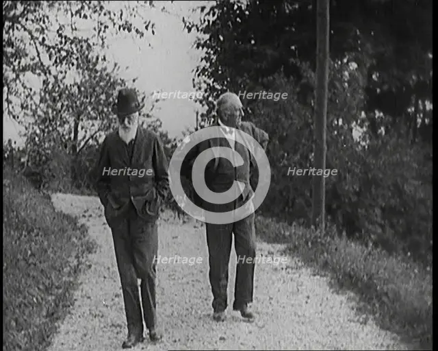 George Bernard Shaw Walking Down a Country Lane With a Male Civilian, 1920s. Creator: British Pathe Ltd.