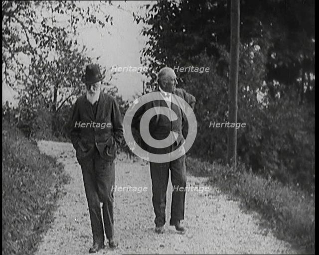 George Bernard Shaw Walking Down a Country Lane With a Male Civilian, 1920s. Creator: British Pathe Ltd.