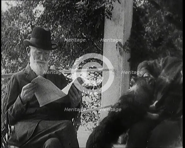 George Bernard Shaw and a Male Civilian Sitting in a Garden, 1920s. Creator: British Pathe Ltd.
