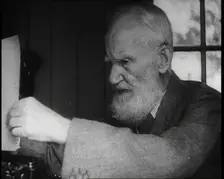 George Bernard Shaw Setting up a Typewriter, 1930s. Creator: British Pathe Ltd