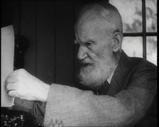George Bernard Shaw Setting up a Typewriter, 1930s. Creator: British Pathe Ltd