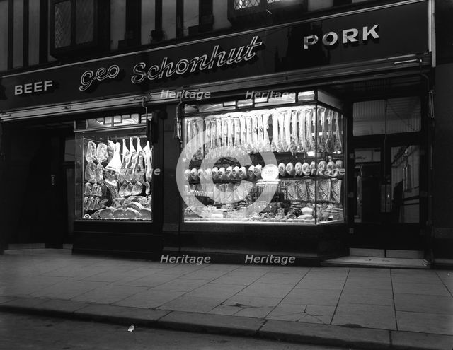 George Schonhut's butcher's shop in Rotherham, South Yorkshire, 1955.  Creator: Michael Walters.