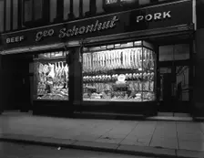 George Schonhut's butcher's shop in Rotherham, South Yorkshire, 1955. Creator: Michael Walters