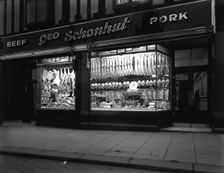 George Schonhut's butcher's shop in Rotherham, South Yorkshire, 1955. Creator: Michael Walters