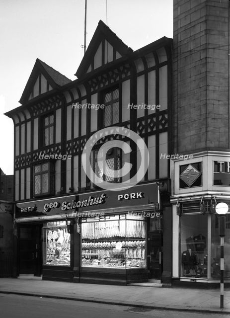 George Schonhut's butchers' shop in Rotherham, South Yorkshire, 1955.  Creator: Michael Walters.