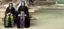 Georgian women in holiday attire in the park of Borzhom, between 1905 and 1915. Creator: Sergey Mikhaylovich Prokudin-Gorsky