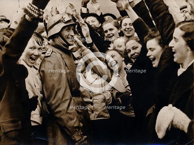 German motorized troops are greeted on their arrival in Vienna, Austria, 1938. Artist: Unknown