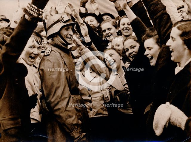 German motorized troops are greeted on their arrival in Vienna, Austria, 1938.  Creator: Unknown.
