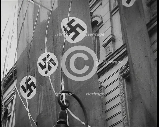 German Nazi Banner Flags Hanging from the Frontage of a Building, 1939. Creator: British Pathe Ltd.