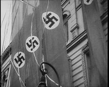 German Nazi Banner Flags Hanging from the Frontage of a Building, 1939. Creator: British Pathe Ltd