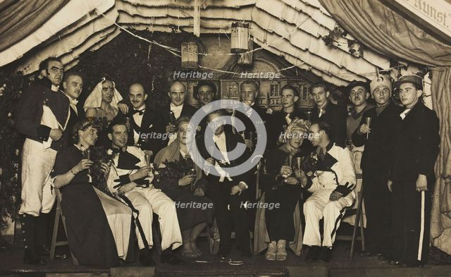 German actors, some in drag, gather on stage at a party, 1930-45. Creator: Unknown.