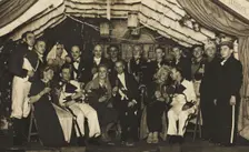 German actors, some in drag, gather on stage at a party, 1930-45. Creator: Unknown