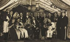 German actors, some in drag, gather on stage at a party, 1930-45. Creator: Unknown