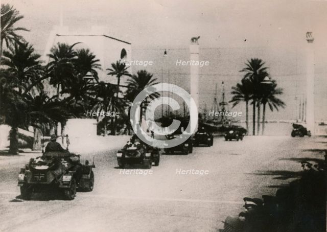 German armoured cars of a Panzer unit drive through Tripolie, West Libya, c.1943.. Artist: Unknown