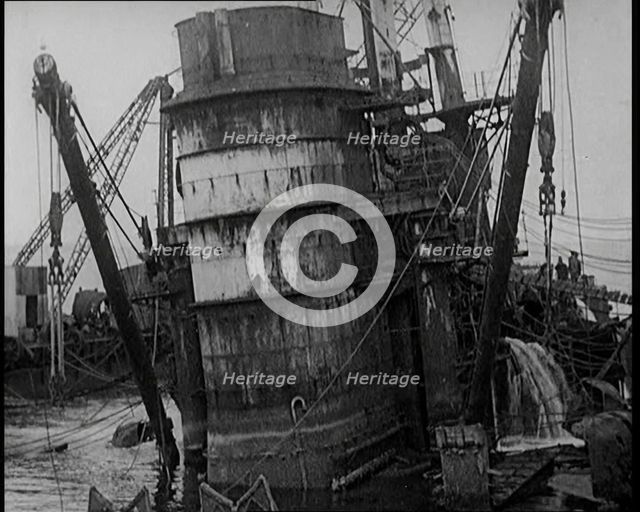 German Battleships Being Salvaged in Scapa Flow, 1926. Creator: British Pathe Ltd.
