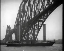 German Boat Passing Under the Forth Bridge in the United Kingdom, 1921. Creator: British Pathe Ltd