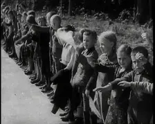 German Children Standing By the Side of a New Road, Some of Them Raising Their Arms in a..., 1937. Creator: British Pathe Ltd