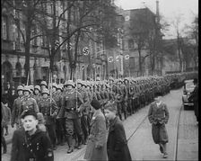 German Civilians Watching German Troops Moving Through the Rhineland, 1936. Creator: British Pathe Ltd