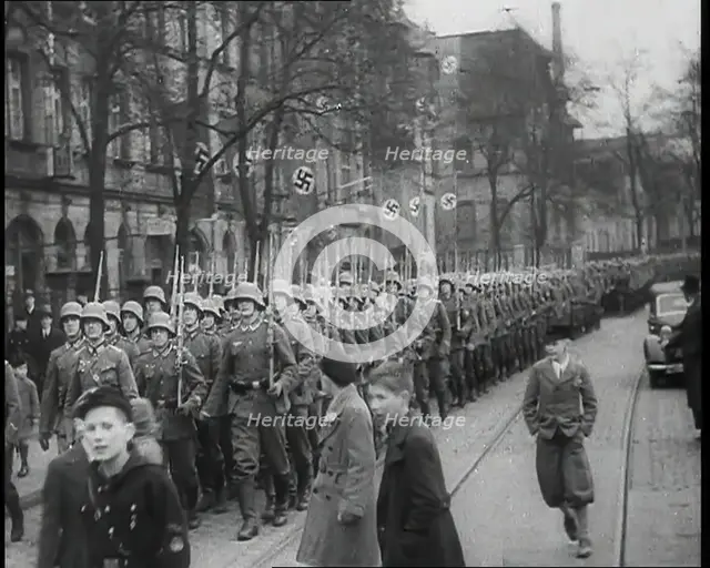 German Civilians Watching German Troops Moving Through the Rhineland, 1936. Creator: British Pathe Ltd.