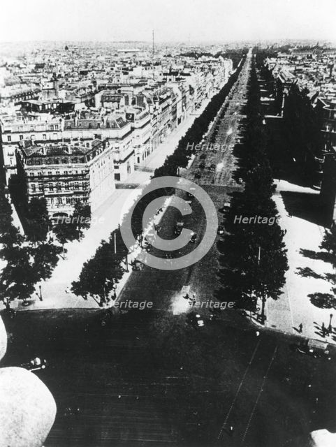 German forces parading along the Champs Elysees, Paris, 14 June 1940. Artist: Unknown