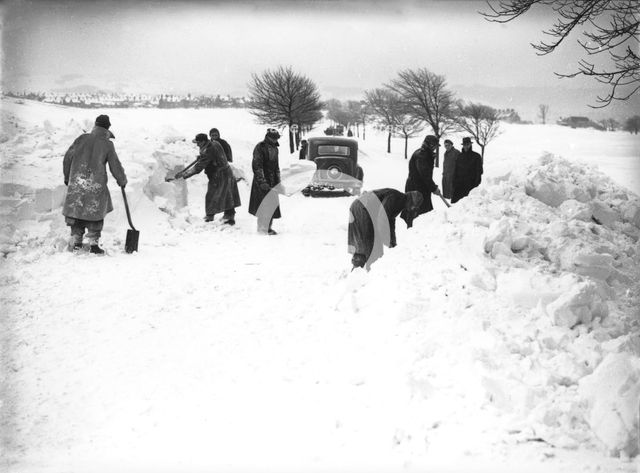 German/Italian prisoners of war clearing snow on Fairfield Common, Buxton, Derbyshire, 1947. Creator: JD Meddins.