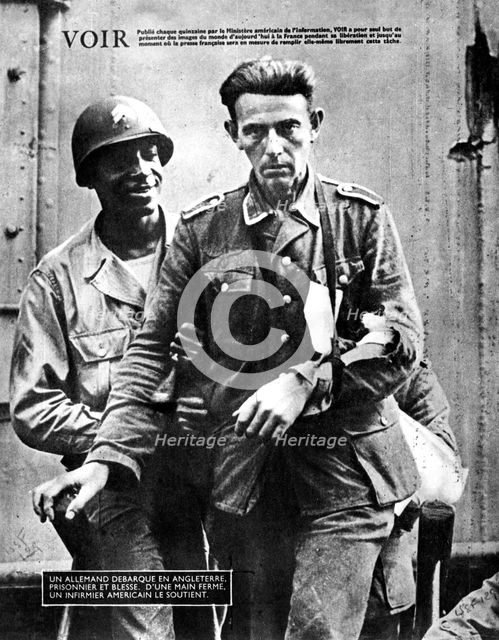 German prisoner of war arriving in England, escorted by an American soldier, 1944. Artist: Unknown