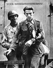 German prisoner of war arriving in England, escorted by an American soldier, 1944