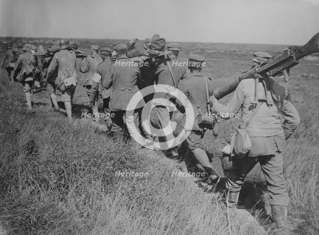 German prisoners with machine guns & wounded, 21 Aug 1918. Creator: Bain News Service.