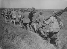 German prisoners with machine guns & wounded, 21 Aug 1918. Creator: Bain News Service