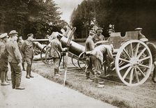 German prisoners cleaning captured guns and trench mortars, France, World War I, 1916