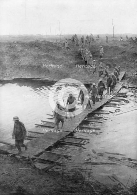 German prisoners on a duckboard track at the Yser Canal, Belgium, 31 July 1917. Artist: Unknown