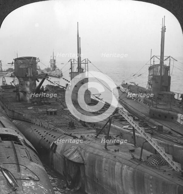 German submarines secured in a Channel port, c1918-c1919. Artist: Realistic Travels Publishers