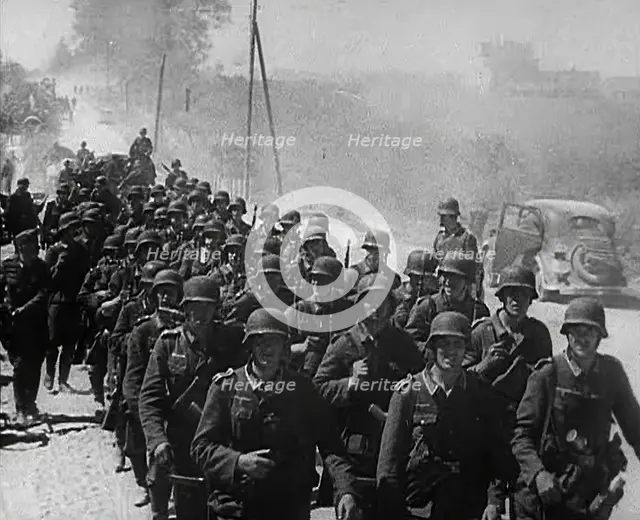 German Soldiers Marching Down a Road, 1941. Creator: British Pathe Ltd.