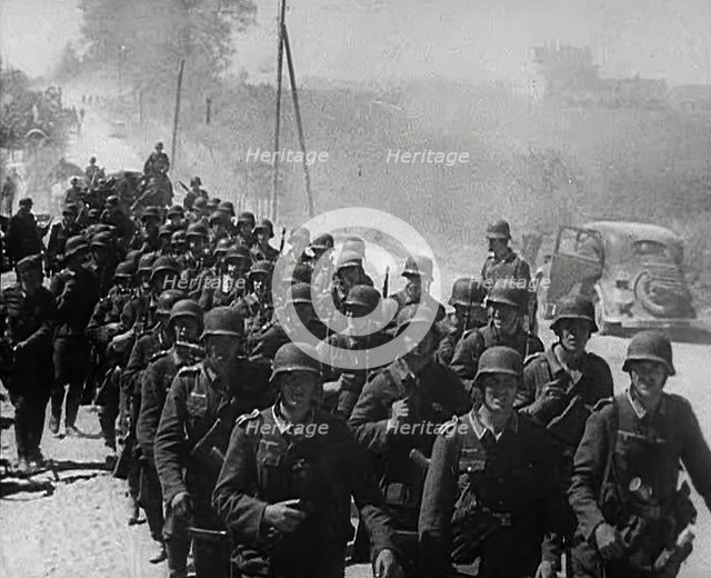 German Soldiers Marching Down a Road, 1941. Creator: British Pathe Ltd.
