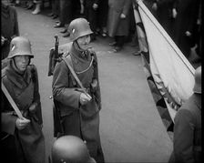 German Soldiers Marching Down a Street as a Crowd Watches, 1930s. Creator: British Pathe Ltd
