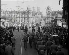 German Soldiers Marching Down a Street as a Crowd Watches, 1930s. Creator: British Pathe Ltd