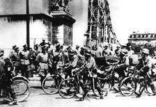 German soldiers marching past the Arc de Triomphe, Paris, 14 June 1940