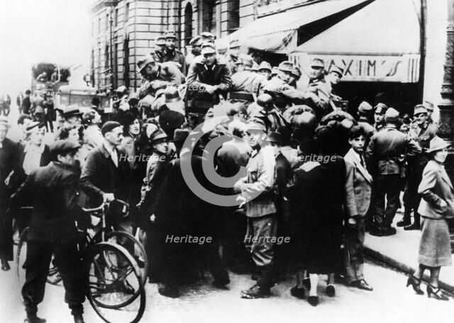 German soldiers outside Maxim's restaurant, Paris, July 1940. Artist: Unknown