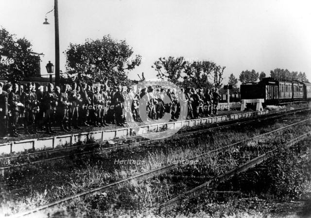 German soldiers on a railway platform awaiting transport, France, August 1940. Artist: Unknown