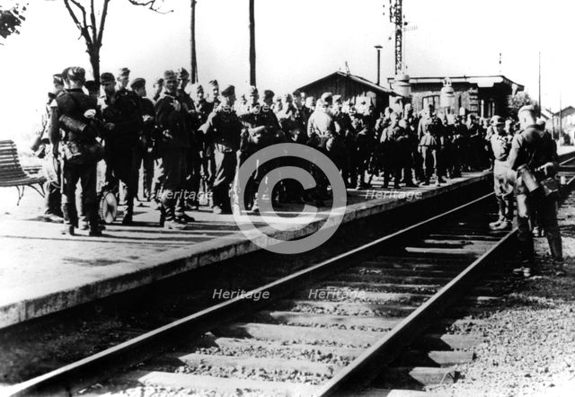 German soldiers on a railway platform awaiting transport, Paris, August 1940. Artist: Unknown