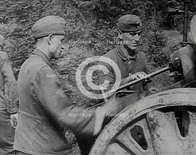 German Soldiers Operating an Artillery Gun, 1941. Creator: British Pathe Ltd.