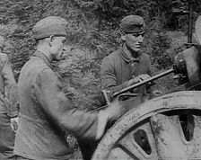 German Soldiers Operating an Artillery Gun, 1941. Creator: British Pathe Ltd