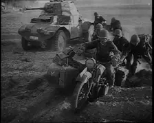 German Soldiers Advancing Through Dusty Fields on Military Vehicles To Cut Off Allied Units..., 1940 Creator: British Pathe Ltd