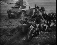 German Soldiers Advancing Through Dusty Fields on Military Vehicles To Cut Off Allied Units..., 1940 Creator: British Pathe Ltd