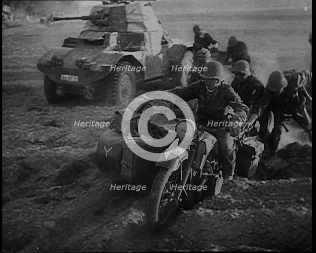German Soldiers Advancing Through Dusty Fields on Military Vehicles To Cut Off Allied Units..., 1940 Creator: British Pathe Ltd.