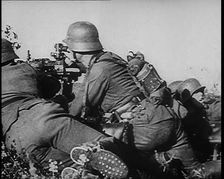 German Soldiers Firing from Cover at Dunkirk, 1940. Creator: British Pathe Ltd