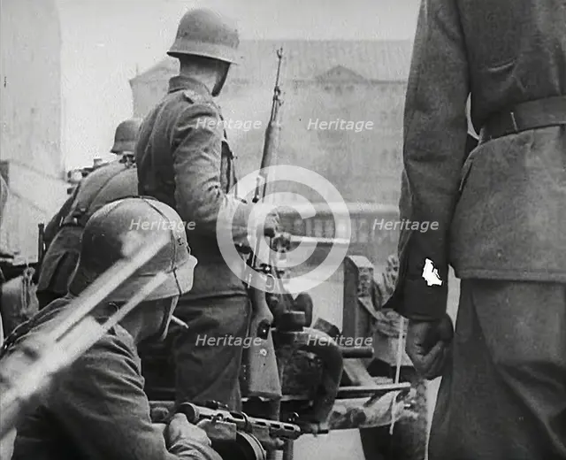 German Soldiers in a Bomb-Damaged Town, 1941. Creator: British Pathe Ltd.