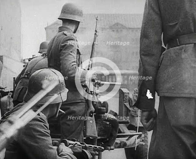 German Soldiers in a Bomb-Damaged Town, 1941. Creator: British Pathe Ltd.