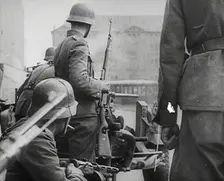 German Soldiers in a Bomb-Damaged Town, 1941. Creator: British Pathe Ltd
