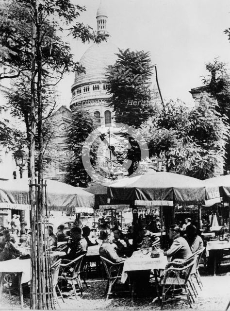 German soldiers relaxing outside a restaurant in Montmartre, Paris, June 1941. Artist: Unknown